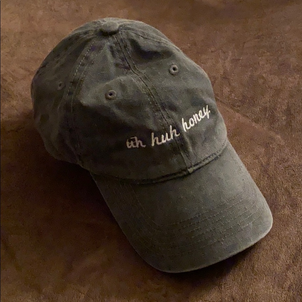 Gray hat with saying on it